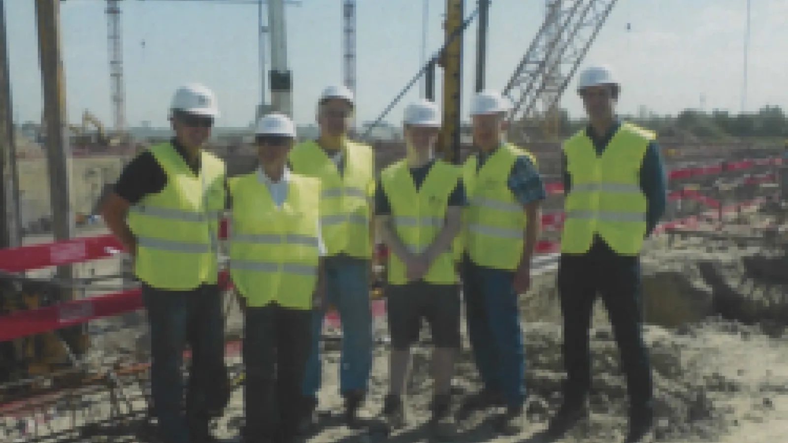 Group wearing high visibility vests and hardhats at EL-ALPS Meeting